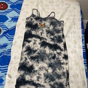 Black,grey,white kids dress with orange butterfly in the middle